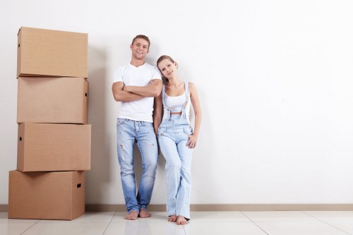 Removal team preparing household items for transport