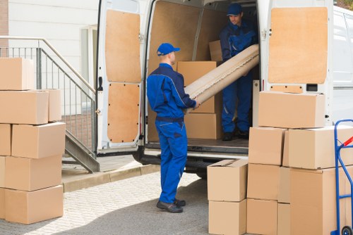 House removals planning in Islington with moving boxes and a van