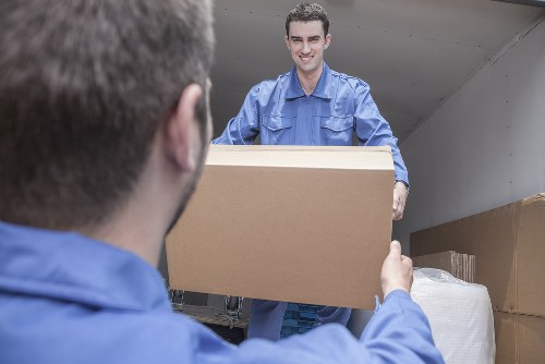 Packing boxes and organising belongings for a move in Islington