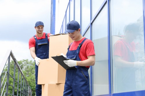 Moving company staff discussing a booking and inventory