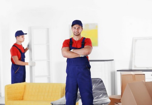 Removal team loading household items into a moving van