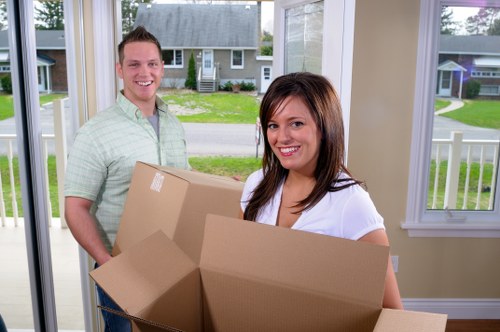 Professional movers handling commercial equipment during an office move in Islington