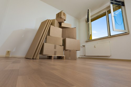 Professional movers carrying furniture during an Islington home relocation