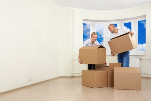 Moving crew handling furniture during a house removal