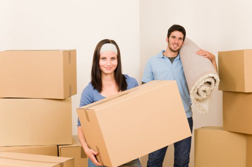 Professional movers navigating a narrow staircase in Islington