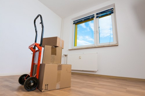 Moving van parked near an Islington residential street for apartment relocation