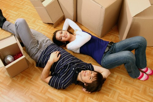 Moving van and removal team outside a residential block in Islington